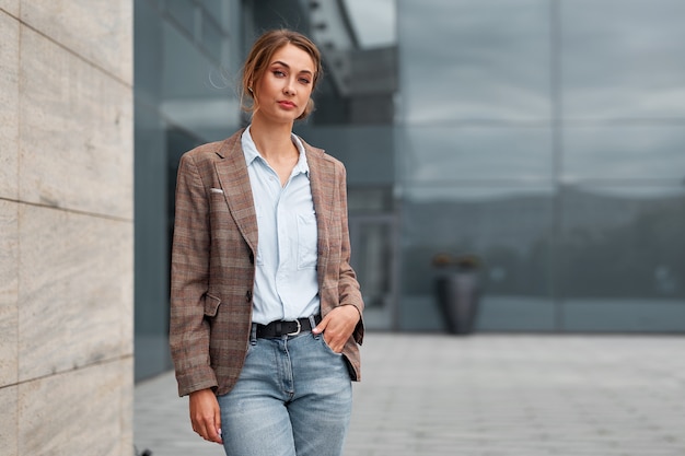 Businesswoman standing outdoor corporate building