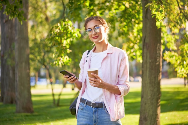 Businesswoman standing summer park Business person