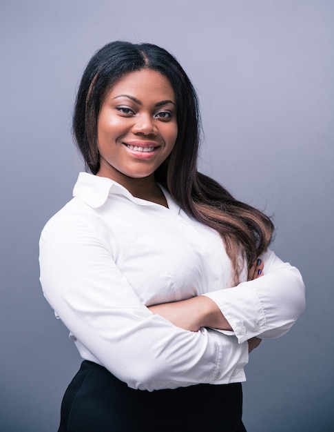 Businesswoman standing with arms folded