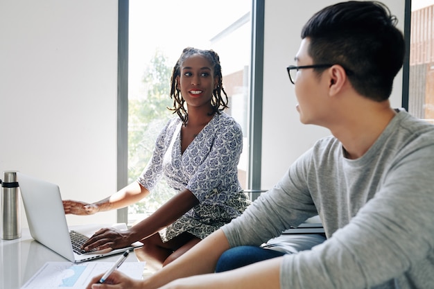 Businesswoman talking to colleague