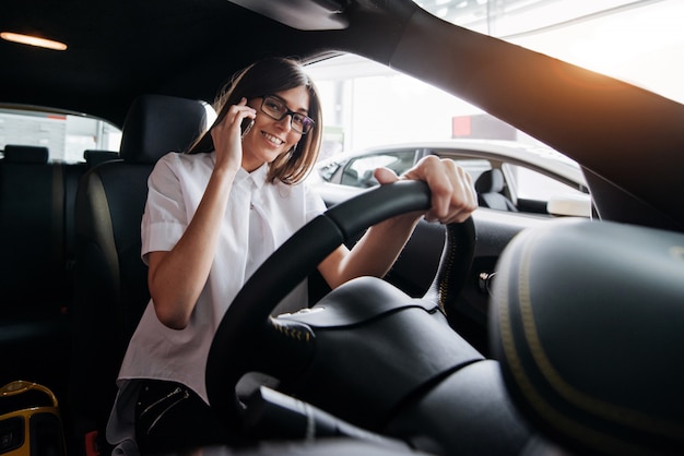 Businesswoman talking on the phone in the car