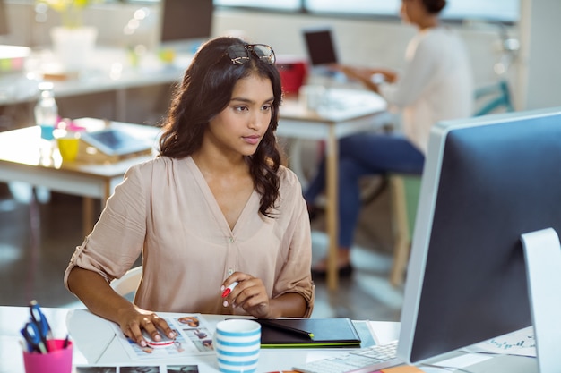 Businesswoman using graphic tablet