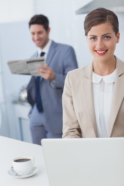 Businesswoman using a laptop before going to work