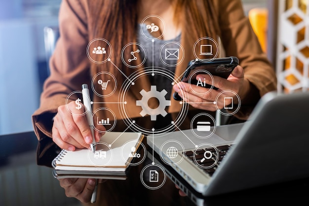 Businesswoman using mobile phone and laptop computer on white desk big data analytics with business intelligence concept. with VR chart and graph with icon