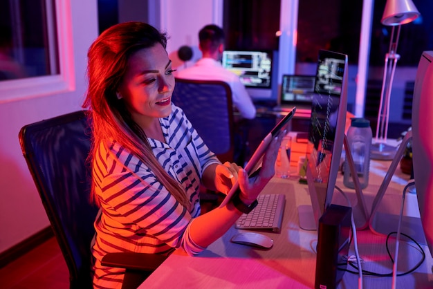 Businesswoman using tablet pc in her work