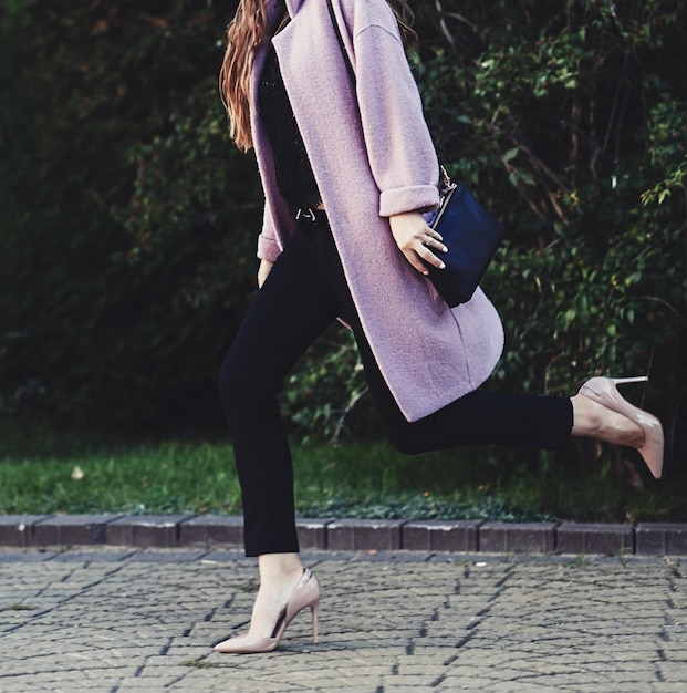 Businesswoman walking on city street