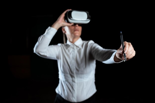 Businesswoman wearing virtual reality simulator and holding pen woman wearing vr headset while