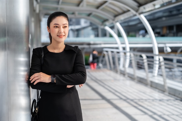 Businesswoman with arms crossed in the city