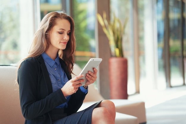 Businesswoman with Digital Tablet in Office