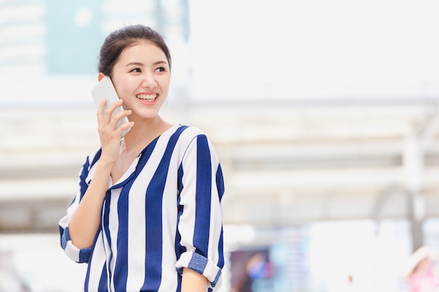 Businesswoman worker talking on smartphone