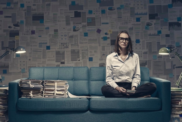 Businesswoman working on the sofa late at night