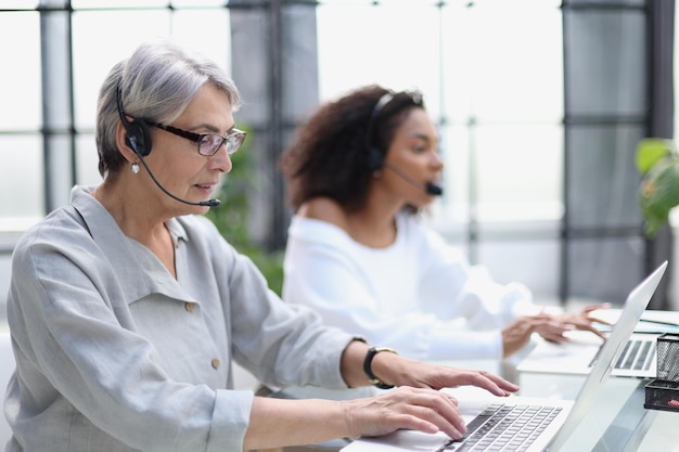 Businesswoman working with a headset and accompanied