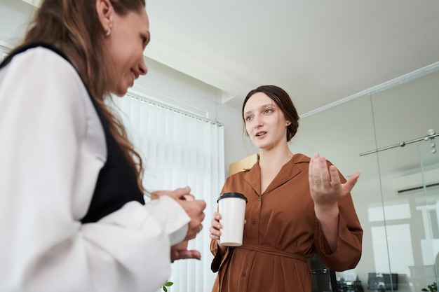 Businesswomen Discussing News and Gossips