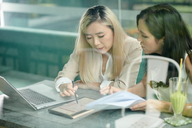 Businesswomen Discussing Statistics