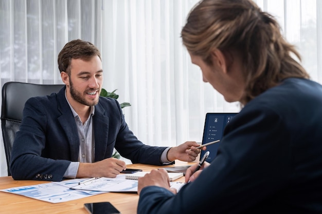 Busy analyst team in office analyzing financial data analysis Entity