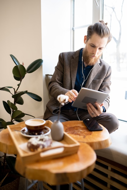 Busy freelancer working in cozy coffee shop