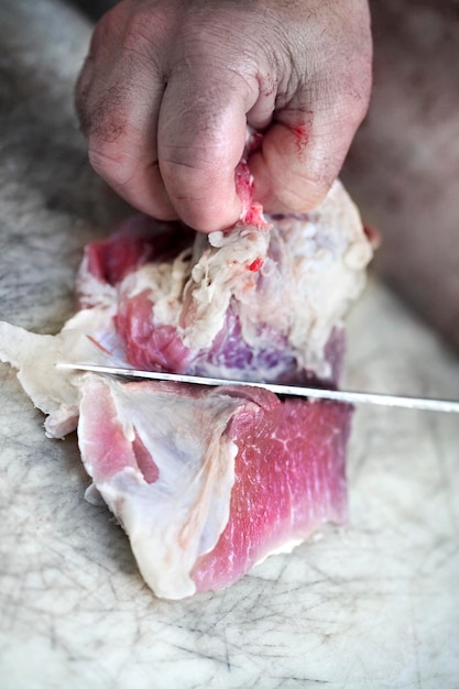 Butcher working on a board