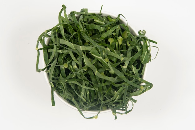 Cabbage chopped into strips in pot isolated