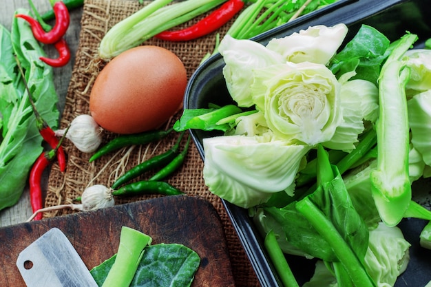 Cabbage and eggs on wooden.