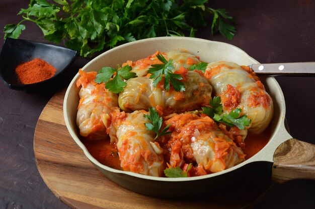 Cabbage rolls stuffed with ground beef and rice in tomato sauce