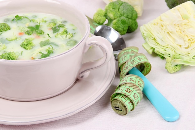 Cabbage soup in plate on napkin closeup