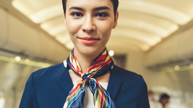 Cabin crew or air hostess working in airplane 