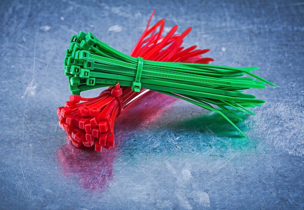 Cable ties on metallic background construction concept