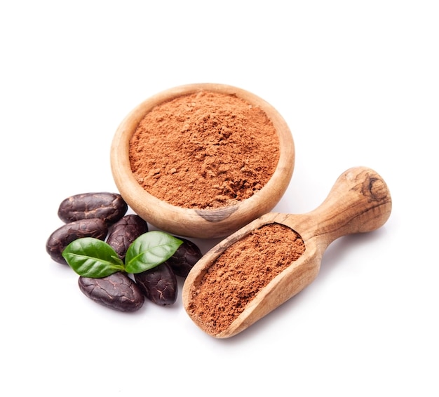 Cacao powder and cacao beans on white backgrounds