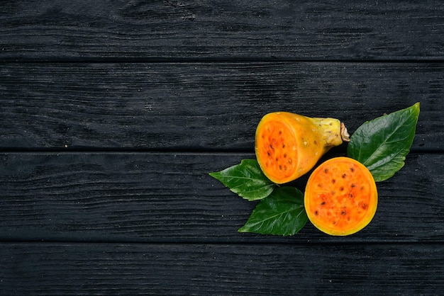 Cactus fruit Tropical Fruits On a wooden background Top view Copy space