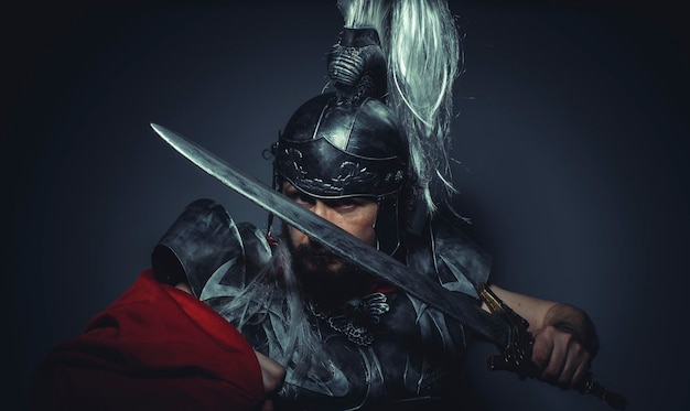 Caesar, Roman centurion with armor and helmet with white chalk, steel sword and long red cape