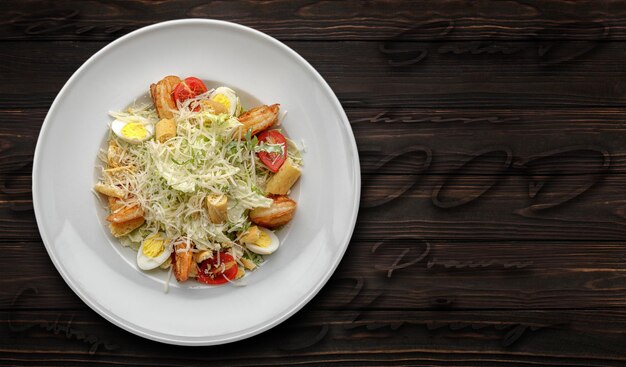 Caesar salad with shrimps on a dark background Banner