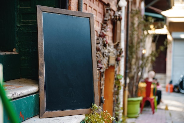 Cafe blank signboard on the street mock up