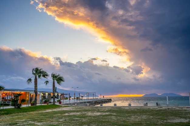 Cafe by the sea restaurant on the beach at sunset