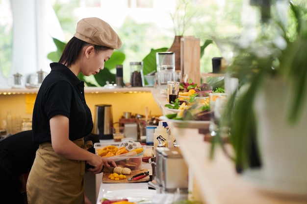 Cafe Cook Cutting Fruits