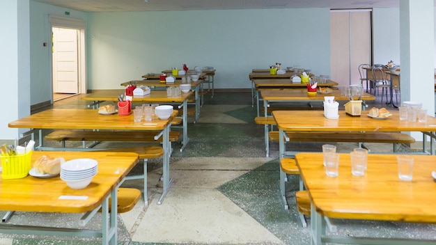 Cafeteria dining room in university cafe with tables and chairs counter bar hotel