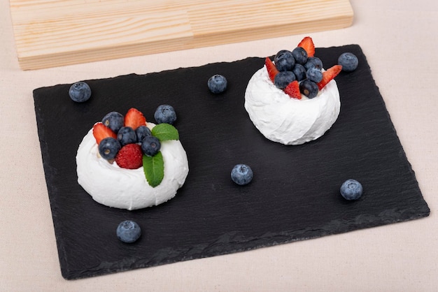 Cake Anna Pavlova Meringue cake with strawberries and blueberries Berry dessert