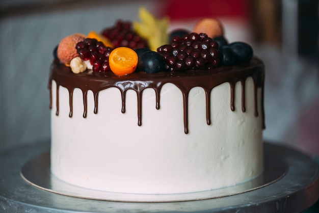 Cake decorated with berries and chocolate