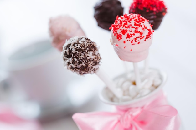 Cake pops in glass, close-up view