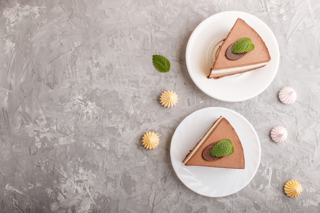 Cake with souffle milk chocolate cream on a gray concrete  background. top view.