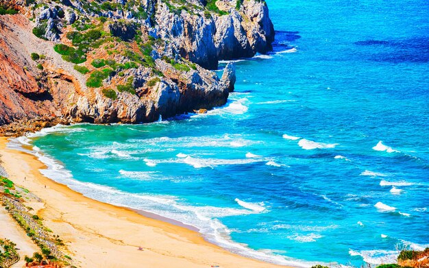 Cala Domestica beach in Buggerru resort at the Mediterranean Sea near Masua and Cagliari province in Carbonia-Iglesias, Sardinia in Italy. Landscape and scenery.