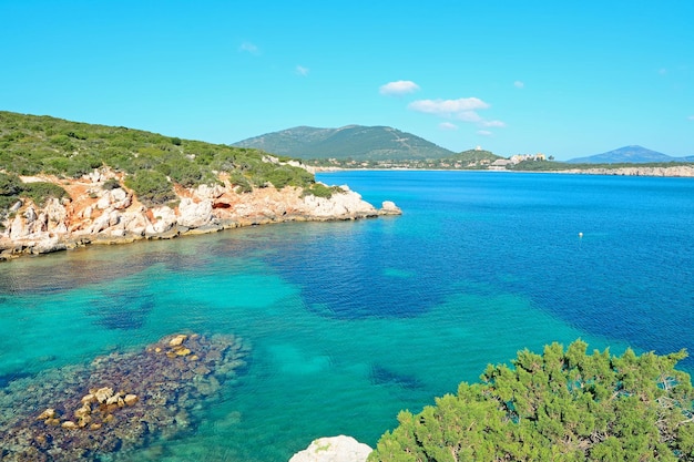 Cala Dragunara clear water under a blue sky