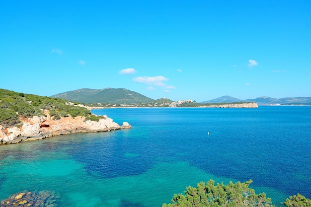 Cala Dragunara clear water under a blue sky