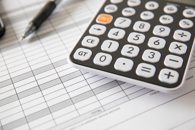 Calculating taxes and profit at office. concept bussines