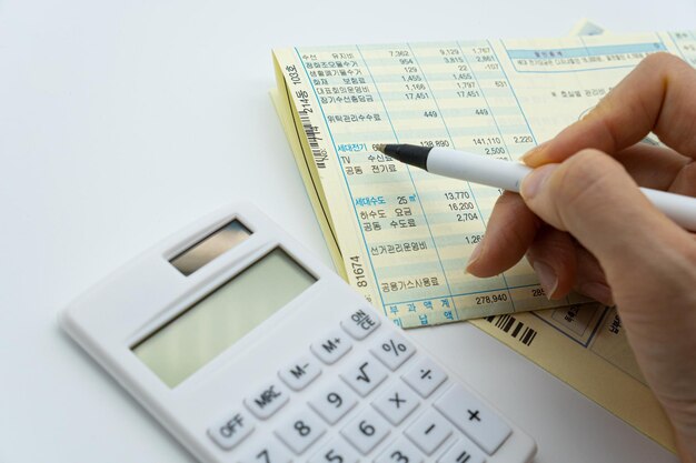 A calculator and a calculator are on a table.