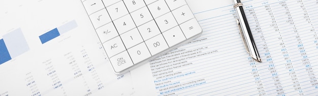 Calculator, Charts and Graphs spreadsheet paper. Finance, Accounting, Statistics and business concept.