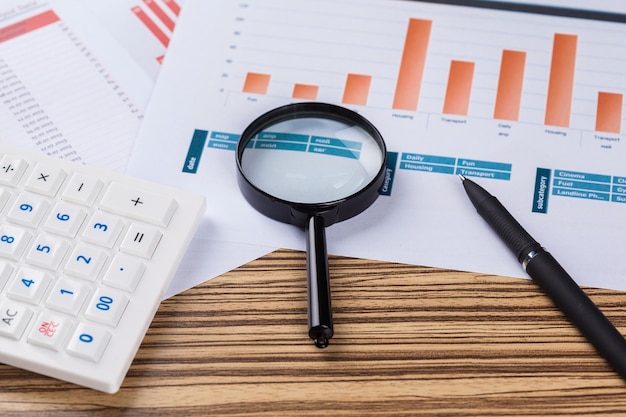 Calculator and magnifying glass on the table