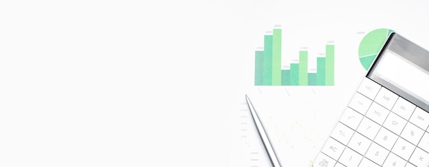 Calculator with pen on stock market analysis. Concept of Business, Finance and Audit research.