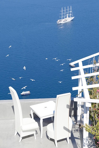 Caldera view with a cruise ship on sea from a terrace of Santorini Island Greece