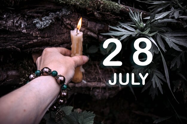 Calendar date on the background of an esoteric spiritual ritual July 28 is the twentyeighth day of the month