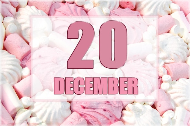 Calendar date on the background of white and pink marshmallows December 20 is the twentieth day of the month